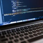 Focused view of programming code displayed on a laptop, ideal for tech and coding themes.